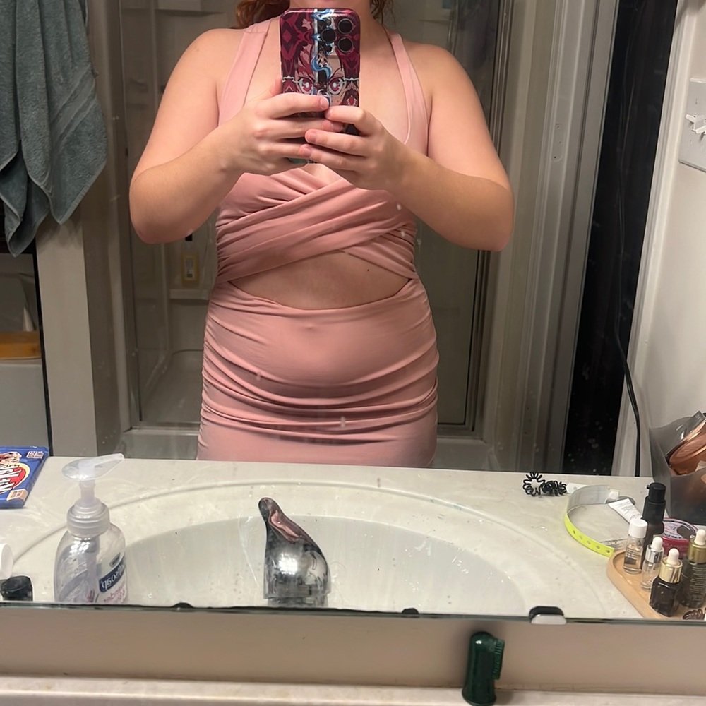 Ruched Fashion Nova mini dress criss-cross straps with midriff showing.